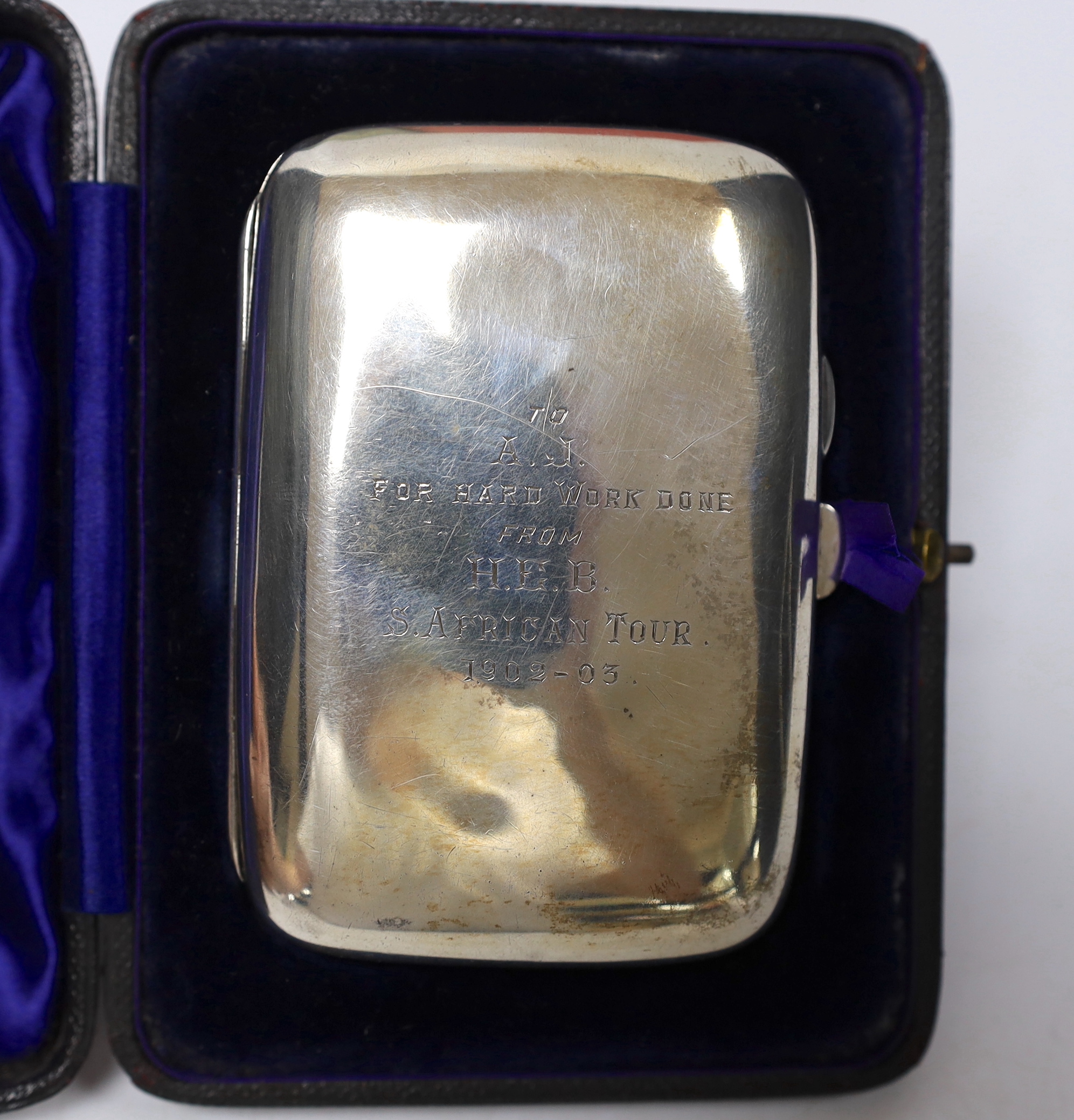 D’Oyly Carte interest; a cased silver cigarette case inscribed ‘To A.J. for hard work done from H.E.B. S. African Tour 1902-03, hallmarked Chester 1902, together with a signed Lindsay Harman, ‘A Comic Life’ and W.S. Gilb